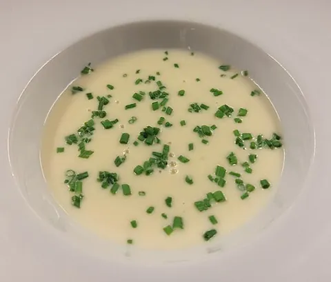 vichyssoise: a thick, creamy soup made from potato, leeks, onions, and chicken stock, and normally served cold