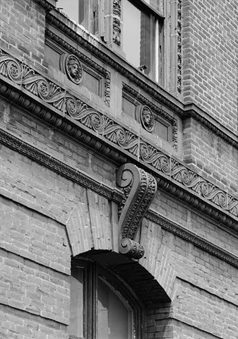 vitruvian scroll: a scroll pattern used in borders and architectural mouldings, resembling waves in water or a series...