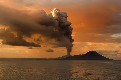 volcano: a vent or fissure on the surface of a planet (usually in a mountainous form) with a magma chamber...