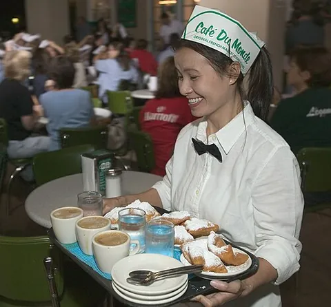 waitress: a female attendant who serves customers in a restaurant, café, or similar