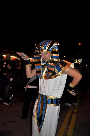 walk like an egyptian: to walk with one arm horizontally at the side, with arm bent at the elbow facing up, and the other...