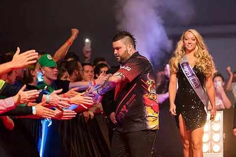 walk-on girl: a woman who escorts a player to the stage at a darts event