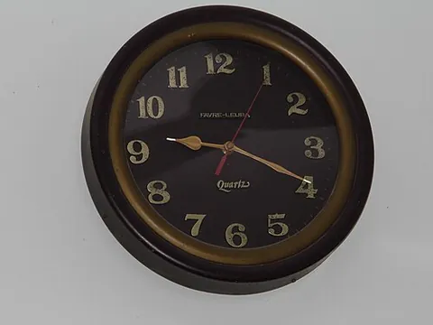 wall clock: a clock mounted on a wall