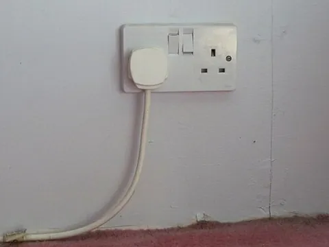 wall socket: a mains electricity power point mounted in or on a wall inside a dwelling or other building
