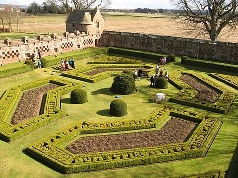 walled garden: a garden enclosed by walls for purposes of shelter or decoration