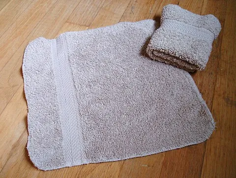 washcloth: a small cloth used to wash the face and body