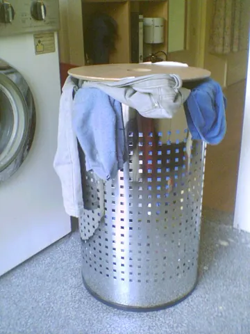washing bin: a bin or container used to store dirty clothes and other items before they are washed