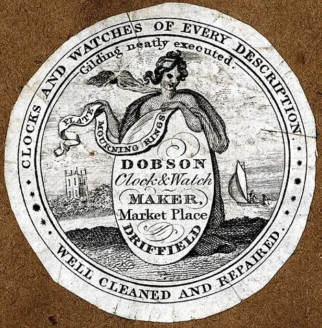 watch paper: a paper label, note, picture, or ornament for the inside of a watchcase