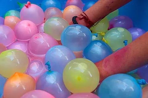 water balloon: a small rubber or latex balloon, filled with water and used as an informal weapon