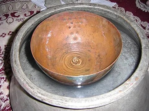 water clock: a device for measuring time using water, typically by measuring water flowing in or out of a basin...