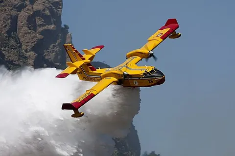 waterbomb: to drop large quantities of water onto (a fire) from the air