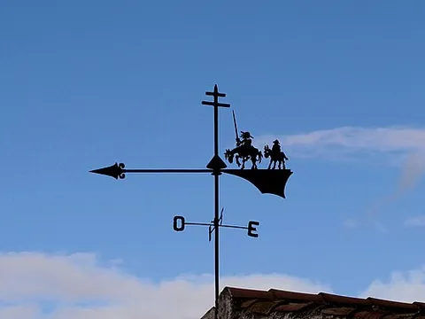 weather vane: a mechanical device rotating around one axis and attached to an elevated object such as a roof for...
