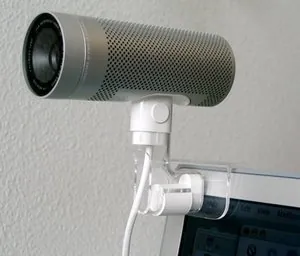 webcam: a video camera whose output may be viewed in real time over a computer network, originally the...