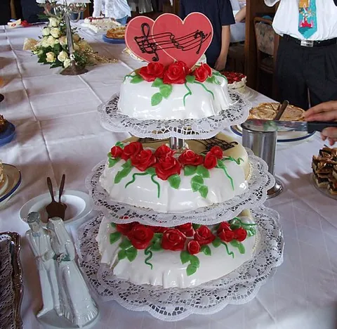 wedding cake: a decorated cake, often in several tiers and with a model bride and groom, that is cut by the...