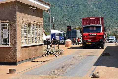weighbridge: a platform, flush with the roadway, having a mechanism for weighing vehicles, wagons, livestock, etc