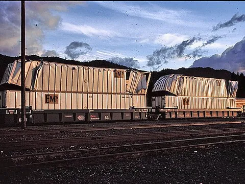 well car: an open low-sided freight car with a lowered body