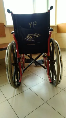 wheelchair: a chair mounted on large wheels for the transportation or use of a sick or disabled person