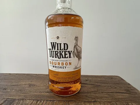 whiskey: a liquor distilled from the fermented mash of grain (as rye, corn, or barley)