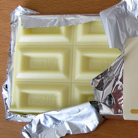 white chocolate: a food made from cocoa butter, milk, and sugar, having no cocoa solids