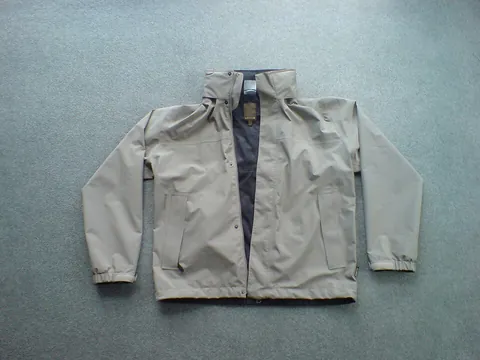 windbreaker: a thin jacket designed to resist wind chill and light rain