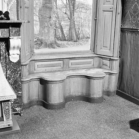 window seat: a typically soft seat placed in a recess, for a window, in a wall, and filling the recess