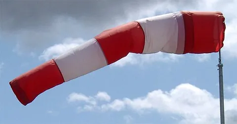 windsock: a large, conical, open-ended tube designed to indicate wind direction and relative wind speed, used...