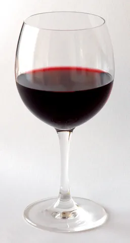 wine glass: a glass vessel, normally with a stem, from which wine is drunk