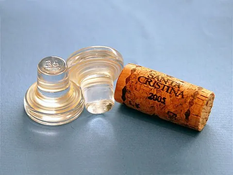 wine stopper: a removable cork that can be inserted into and extracted from the neck of a wine bottle
