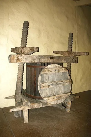 winepress: a press used to extract juice from grapes as the first step of winemaking