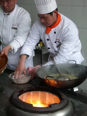 wok: a large, round-bottomed cooking pan used in East Asian cooking