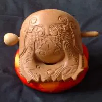 wooden fish: a wooden percussion instrument played by monks and lay people in the Mahayana Buddhist tradition in...