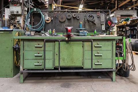 workbench: a sturdy bench or table at which manual work is done by a carpenter, machinist, etc