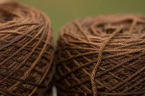 worsted: yarn made from long strands of wool