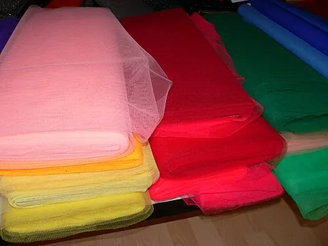woven: fabricated by weaving
