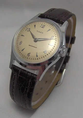 wristwatch: a watch that is worn on a strap or band fastened around the wrist