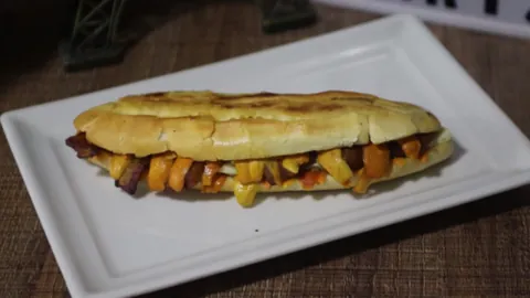 x-caboquinho: a sandwich consisting of sliced buttered marraqueta bread and other ingredients, typical to the...