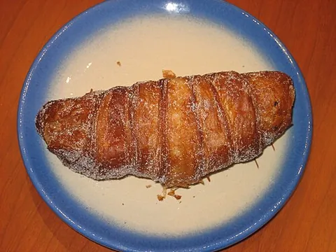 xuixo: a viennoiserie pastry filled with crema catalana, from Girona in Catalonia, Spain