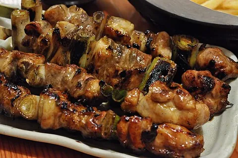 yakitori: a Japanese shish kebab-type dish made with small pieces of chicken or other ingredients cooked on...