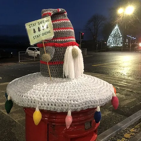 yarn bomb: to cover (a public structure) with decorative knitted yarn, as a form of graffiti or street art