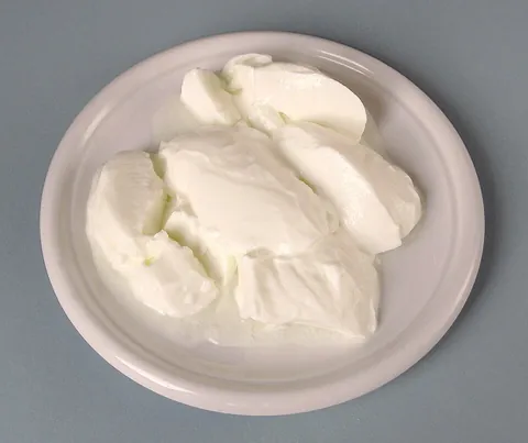 yogurt: a milk-based product stiffened by a bacterium-aided curdling process, and sometimes mixed with...