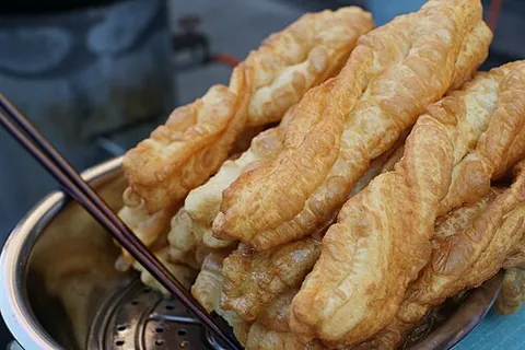 youtiao: a type of deep-fried dough stick eaten in China and other East and Southeast Asian cuisines