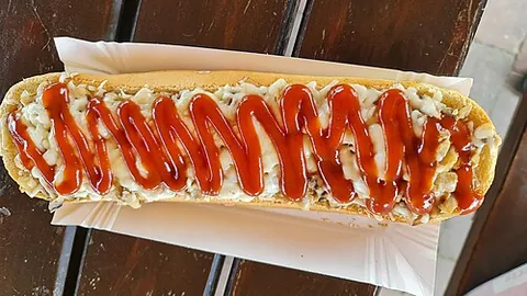 zapiekanka: a Polish fast food consisting of a baguette with mushrooms, cheese, and ketchup; may also contain...