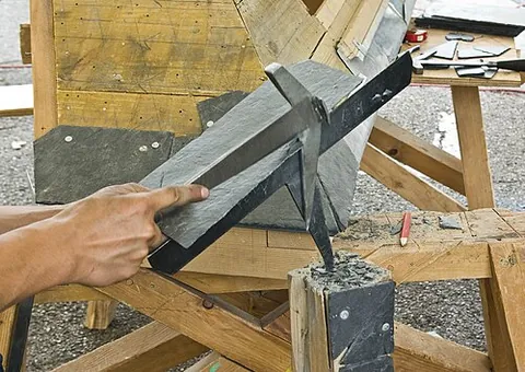 zax: a tool, similar to a hatchet, used to prepare slate for roofing