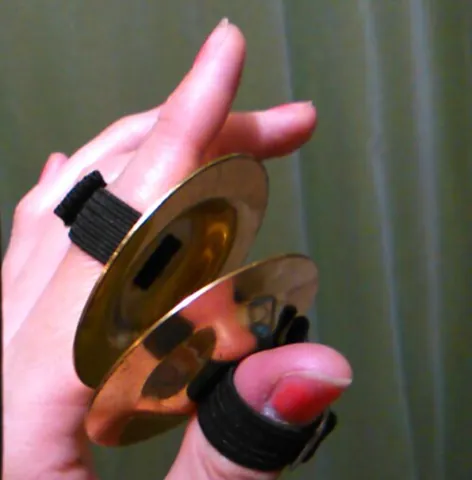 zill: one of a set of small finger cymbals used in belly dancing and similar performances