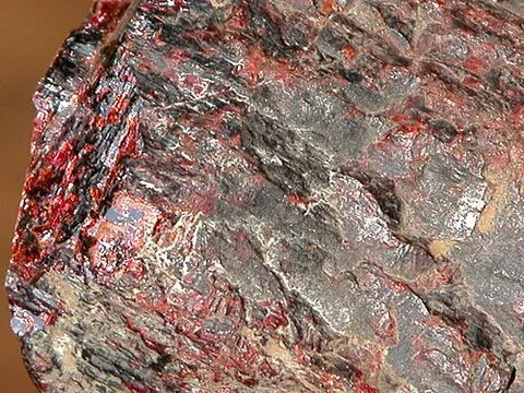 zincite: a yellow, orange or dark-red mineral form of zinc oxide, often also containing small amounts of...