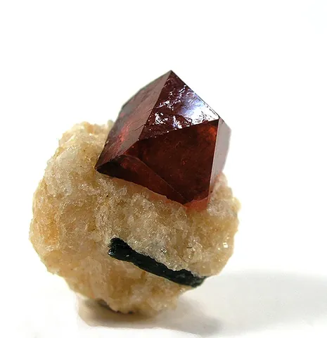 zircon: a mineral occurring in tetragonal crystals, usually of a brown or grey colour and consisting of...