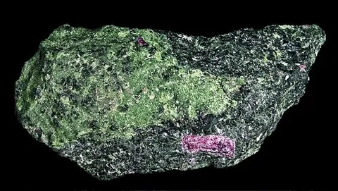 zoisite: a mineral with orthorhombic crystals, Ca₂Al₃(SiO₄)(Si₂O₇)O(OH)