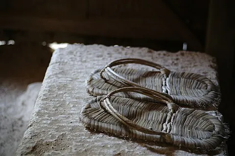 zori: a Japanese sandal made from rice straw or lacquered wood, worn with a kimono for formal occasions