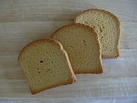 zwieback: a form of rusk, usually sweetened bread enriched with eggs that is baked and then sliced and...